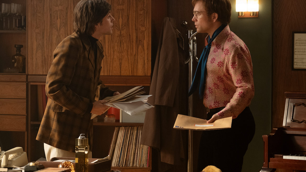 Charlie Rowe plays Ray Williams and Taron Egerton plays Elton John in Rocketman from Paramount Pictures.